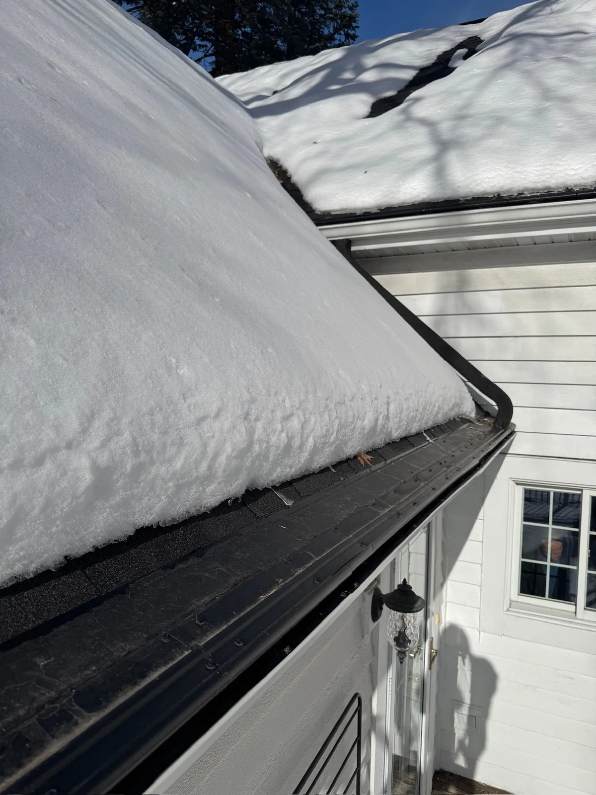 Snow melting clear of a Heater Cap heated gutter